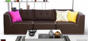 Μαύρος μοντέρνος καναπές με καπιτονέ κάθισμα και πολύχρωμα μαξιλάρια